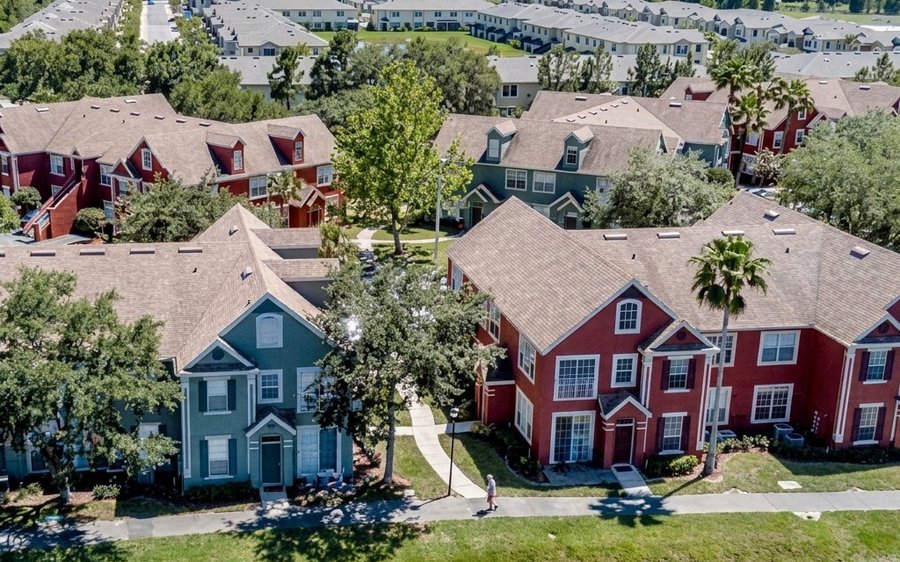Drone aerial of a lakefront townhome community from one of Samantha's listings
