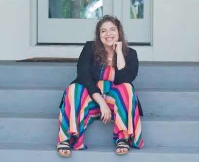 Samantha Greene sitting on porch steps